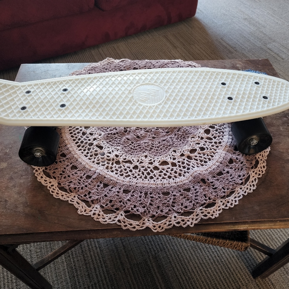 Skateboard. Smaller size. Brand new. White. Glow-in-the-dark!
